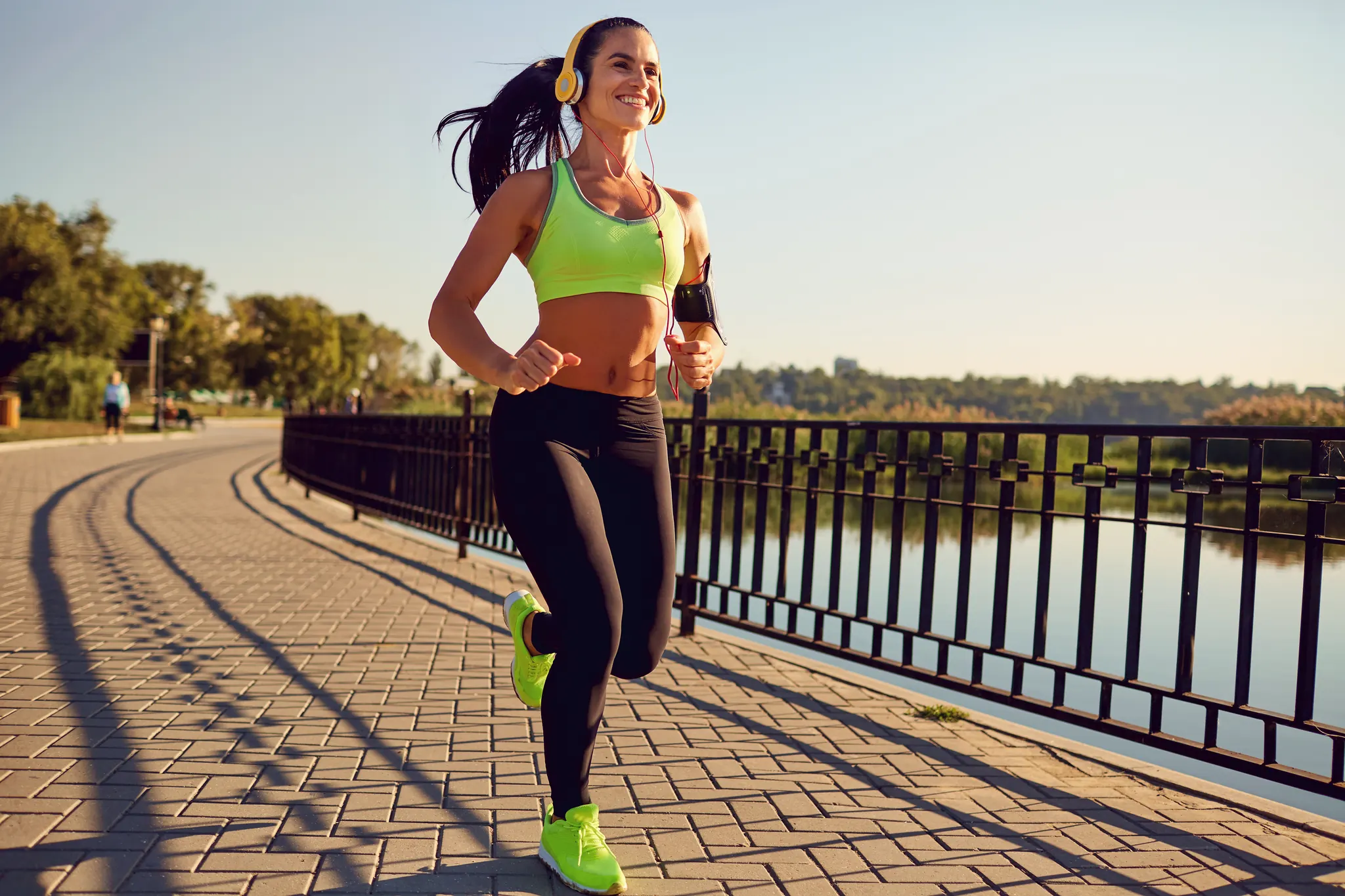 Woman jogging along a waterfront path — the ideal candidate